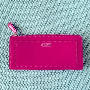Dark pink Coach wallet with tan inside